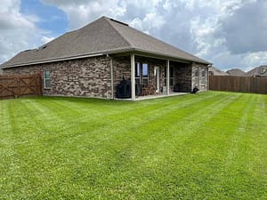 Brick house with freshly mowed lawn